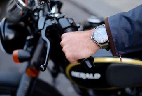A Zenith Pilot Ton Up watch worn astride a Herald Classic 125. Photograph by Justin Hast.
