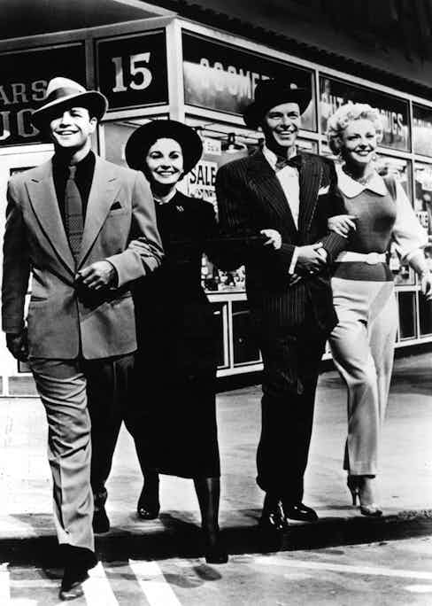 Marlon Brando, Jean Simmons, Frank sinatra and Vivian Blaine in a scene from the film 'Guys And Dolls', 1955. Photo by Metro-Goldwyn-Mayer/Getty Images.