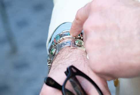 Approaching a century old, both of Alessandro’s bracelets are of Navajo heritage. The one he is pointing at was a gift on his 40th birthday, and the other is from Santa Fe, made from a 1920s silver dollar coin. 