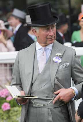Prince Charles displaying his double-breasted waistcoat replete with pocket watch at Ascot in 2015. Although a curious decision to also wear a wristwatch, The Rake would never doubt His Royal Highness.
