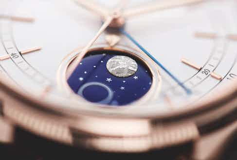 The white lacquer dial, 18 carat Everose gold case and blue enamel disc of Rolex’s first moonphase complication.