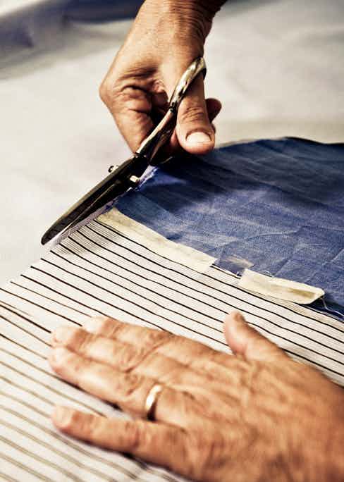 The hand-cutting of fabric in Santillo's atelier.