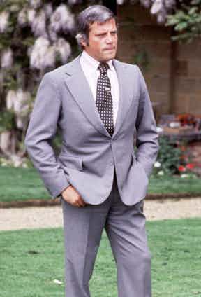 Reed wears a grey single-breasted suit with spotted tie and tie pin in the TV programme Today, 1977. Photograph by FremantleMedia Ltd/REX/Shutterstock.