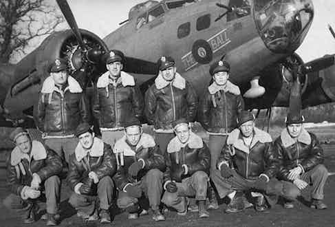 A B-17 WWII Bomber, "The 8 Ball" and its full crew, all wearing the military legend B-3 sheepskin bomber jacket, circa 1939.