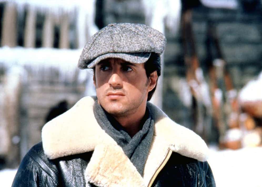 Sylvester Stallone tackles the elements in Rocky IV, in a hefty shearling coat and peaked cap.