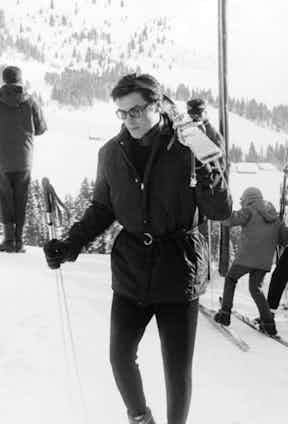 Alain Delon transferred his usual elegance and sophistication to the slopes in a belted ski-jacket and long johns, accessorised with a neck scarf and glasses, in Megève, France, 1963.