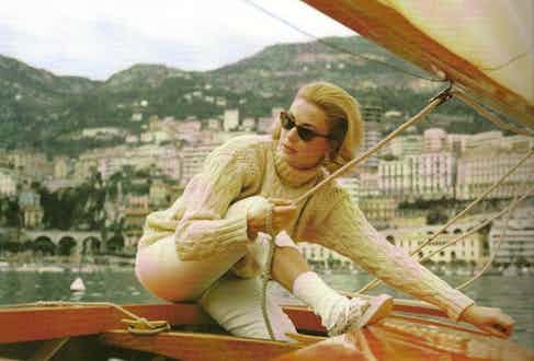 Grace Kelly gives the pattern a sporty yet classy edge as she dons a white cable turtleneck for sailing in Monaco.