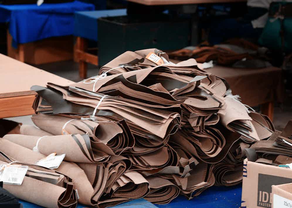 Bundles of parts that have been cut by hand waiting to be assembled.