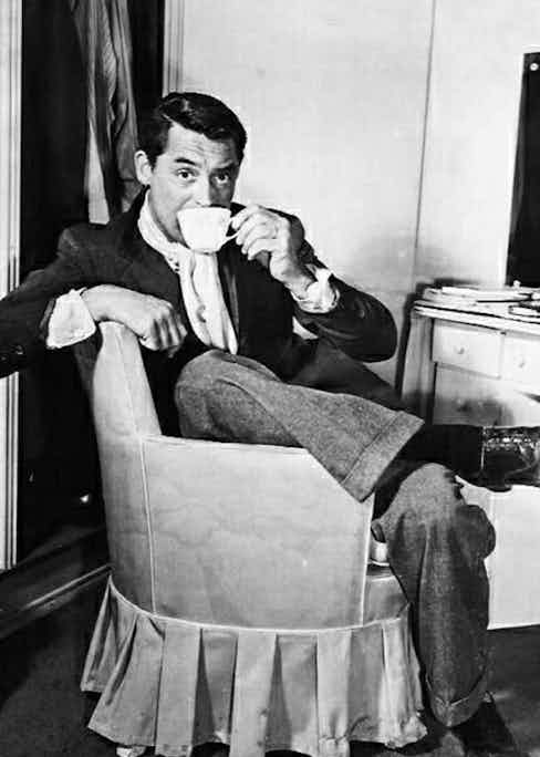 Cary Grant sipping coffee in style.