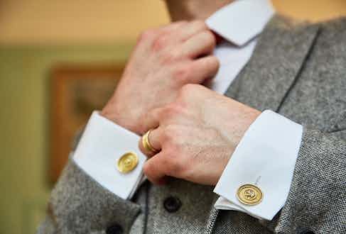 Elizabeth Gage's gold coin cufflinks make for a striking addition to suiting.