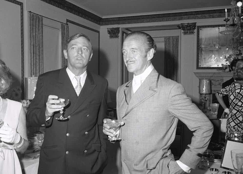 David Niven chats with author and magazine publisher William Buckley. (Photo by Bettmann/Getty Images)