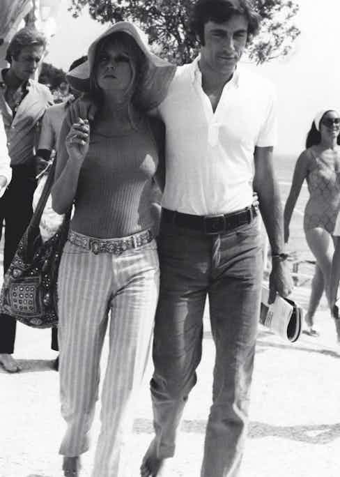 The French actress and model Brigitte Bardot walking with the Italian actor and playboy Gigi Rizzi. Saint-Tropez, August 1968 (Photo by Mondadori Portfolio via Getty Images)