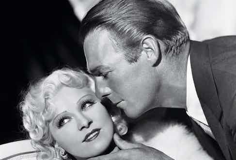 Randolph Scott caresses Mae West's chin in Go West Young Man, 1936