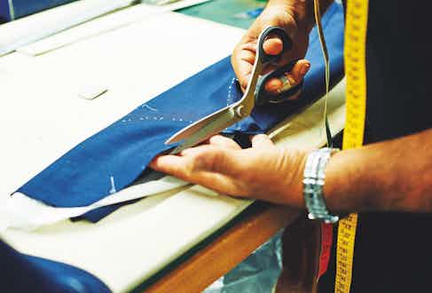 A demonstration of the different handcrafted techniques that go into a bespoke suit: cutting