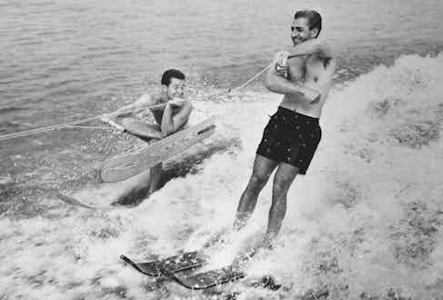 On holiday with former world waterskiing champion Dick Pope Jr, 1955 (Photo via Getty)